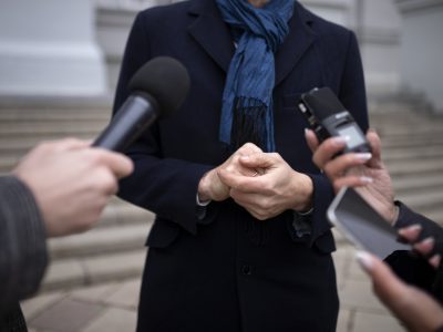 close-up-reporter-taking-interview